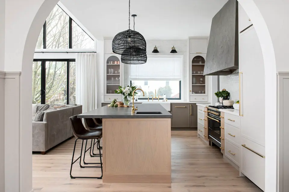 The same kitchen under a gable window, seen through the arch